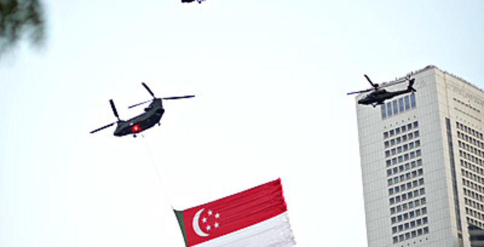 Attack helicopters with the Singapore flag on National Day